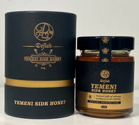 Spoonful of raw Dejlah Yemeni Sidr Honey showing rich texture and golden color